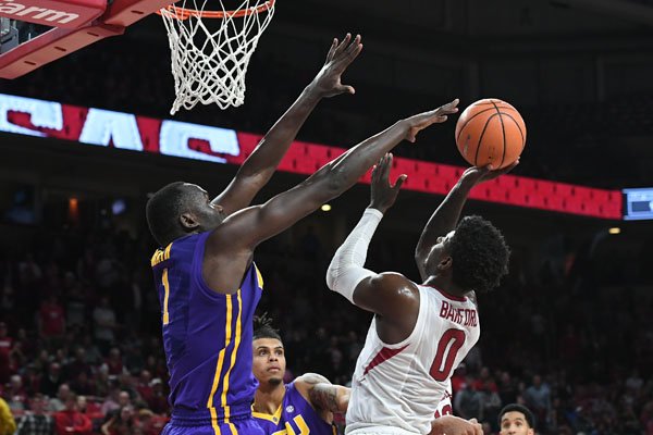 Arkansas guard Jaylen Barford has a shot contested by LSU forward Duop Reath during a game Wednesday, Jan. 10, 2018, in Fayetteville. 