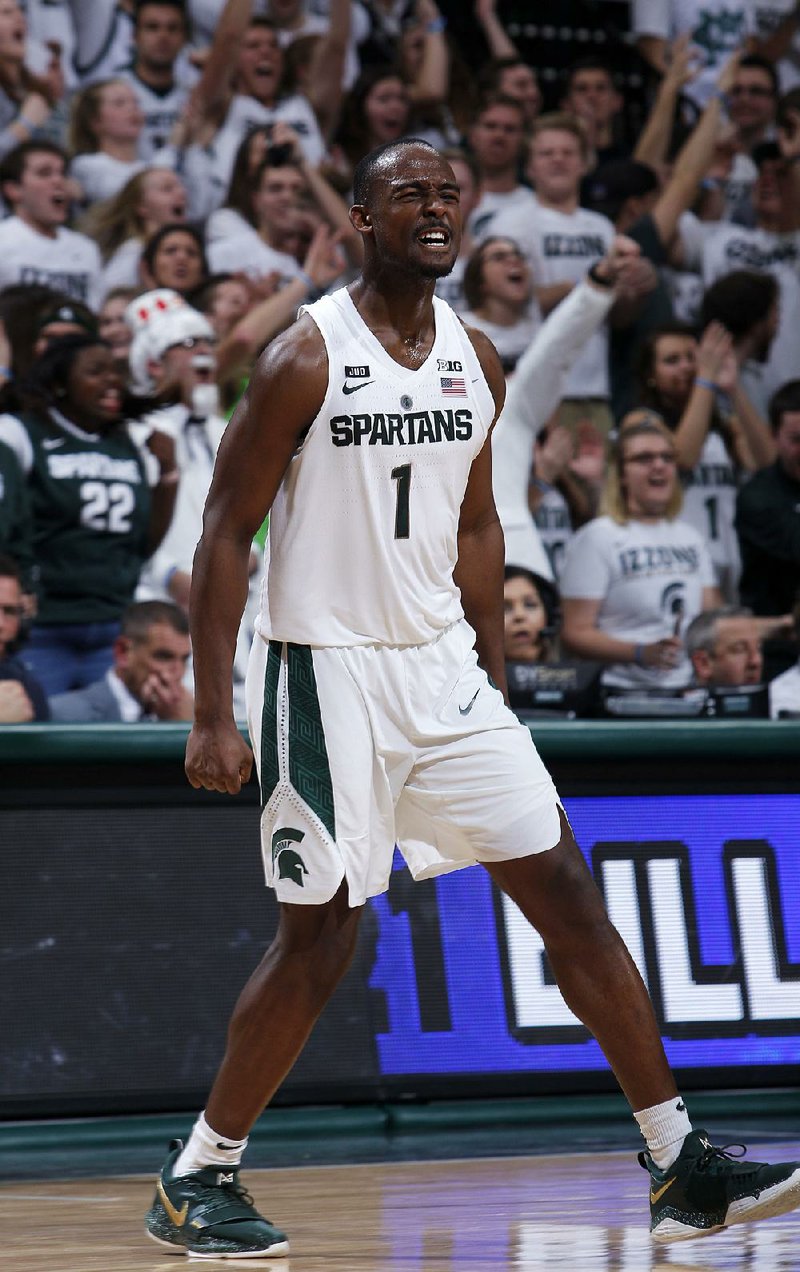 Michigan State’s Joshua Langford celebrates his three-pointer in overtime during the Spartans’ 76-72 victory over Rutgers on Wednesday night in East Lansing, Mich. 