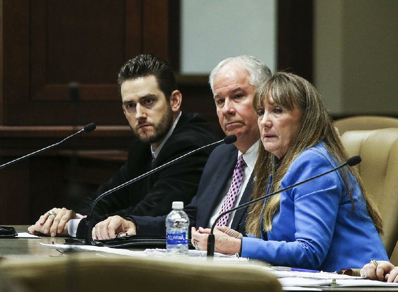 Former Arkansas Community Correction Director Sheila Sharp and new Arkansas Community Correction Director Kevin Murphy (center) are shown in this file photo with Deputy Director Administrative Services Chad Brown (left).