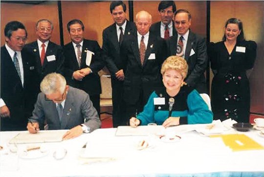 Submitted photo OPEN HOUSE: Mayor Melinda Baran, right, signs the sister city agreement on behalf of the city of Hot Springs on Jan. 15, 1993. A celebration to commemorate the sister city relationship between Hot Springs and Hanamaki, Japan will be held on Monday at the new Sister City office, 108 Pleasant St.