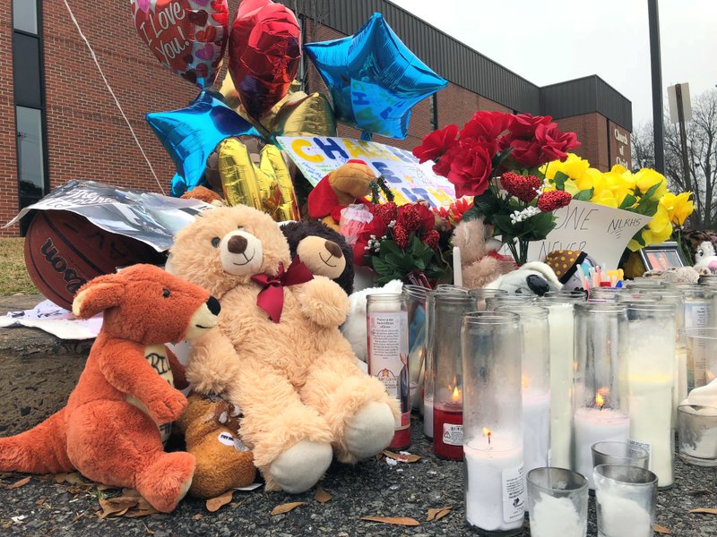 A makeshift memorial is set up Wednesday along a road in North Little Rock, Ark., where teenager Charles Smith was shot and killed by police on Sunday. The city police chief on Wednesday released video from a traffic stop which shows the teenager firing a gun at officers. Chief Mike Davis said he wanted to quell misinformation about the case. (AP Photo/Kelly P. Kissel)