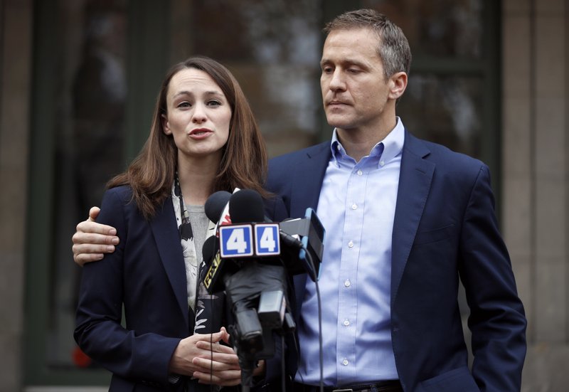 FILE - In this Dec. 6, 2016, file photo, Missouri Gov.-elect Eric Greitens and his wife Sheena speak to the media in St. Louis after she had been robbed at gunpoint the day before. Responding to a news report that overshadowed his annual State of the State address Wednesday night, Jan. 10, 2018, the Republican governor acknowledged he's been "unfaithful" in his marriage but denied allegations that he blackmailed the woman to stay quiet. The couple released a statement late Wednesday after the report that he had a sexual relationship with his former hairdresser in 2015. (AP Photo/Jeff Roberson, File)


