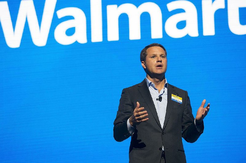 Walmart CEO Doug McMillon speaks during the Walmart shareholders meeting Friday, June 2, 2017, at Bud Walton Arena in Fayetteville, Ark.
