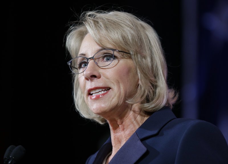 In this Oct. 13, 2017 file photo, U.S. Education Secretary Betsy DeVos speaks during a dinner hosted by the Washington Policy Center, in Bellevue, Wash. 
 (AP Photo/Ted S. Warren)