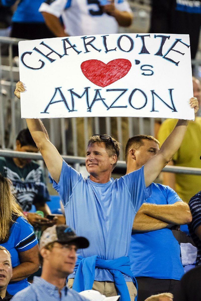 In mid-October, a Carolina Panthers fan shows his desire for Amazon to make Charlotte, N.C., its East Coast headquarters before an NFL home game against the Philadelphia Eagles. 