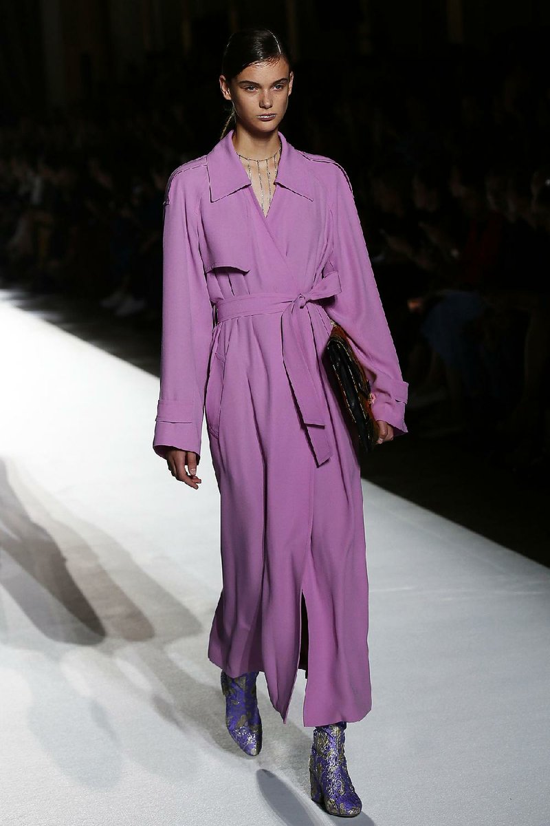 Lovely lavender and a trendy trench: A model shows off two big spring 2018 fashion looks in one during the Dries Van Noten spring-summer 2018 ready-to-wear fashion collection presented Sept. 27 in Paris.