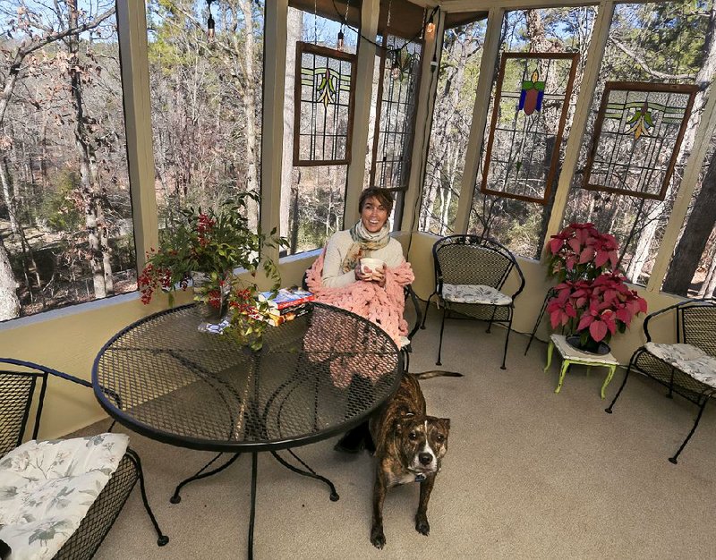 Erin Taylor on the porch of her west Little Rock home.