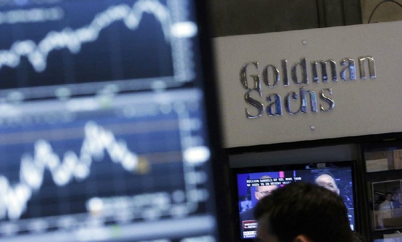 A screen at a trading post on the floor of the New York Stock Exchange is juxtaposed with the Goldman Sachs booth. Goldman Sachs will start offering home-improvement loans this month. 