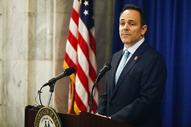 Kentucky Gov. Matt Bevin announces federal approval of Kentucky's Medicaid waiver in the Capitol Rotunda in Frankfort, Ky., Friday, Jan. 12, 2018. 