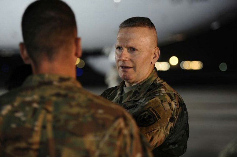 US Army Command Sgt. Maj. John Wayne Troxell, the senior enlisted adviser to Gen. Joseph F. Dunford, the chairman of the Joint Chiefs of Staff, speaks on the flightline of Al Dhafra Air Base in the United Arab Emirates on Dec. 22.