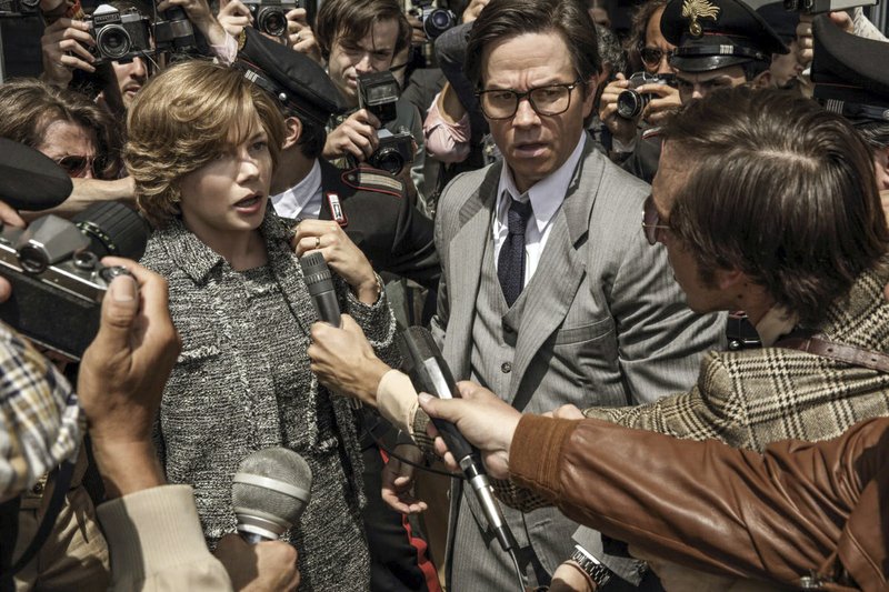 FILE - This image released by Sony Pictures shows Michelle Williams, left, and Mark Wahlberg in TriStar Pictures' "All The Money in the World." After an outcry over a significant disparity in pay with Williams, Wahlberg has agreed to donate the $1.5 million he earned for reshoots on the movie to the anti-sexual misconduct initiative Time’s Up, in Williams' name, announced Saturday, Jan. 13, 2018. (Fabio Lovino/Sony-TriStar Pictures via AP)