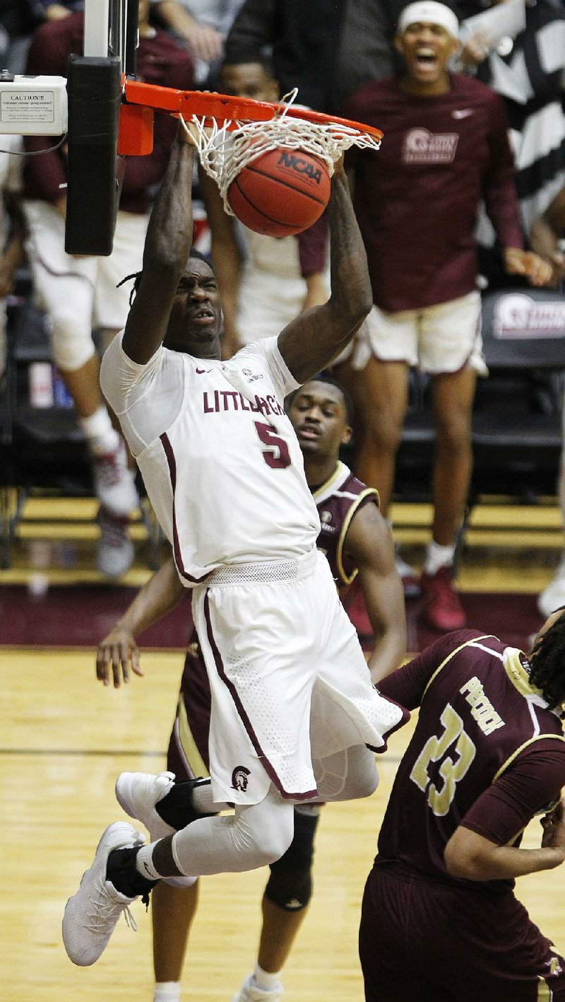 UALR’s Oliver Black dunks to tie the game at 70-70 on Saturday, but Texas State responded to win 72-70. 
