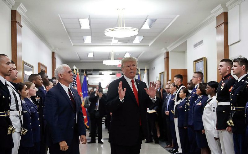 President Donald Trump and Vice President Mike Pence visit the Pentagon on July 20. Trump’s administration wants to develop new nuclear weapons and present a generally more aggressive nuclear stance, according to a policy statement that in some ways reaffirms the nuclear policy of former President Barack Obama.