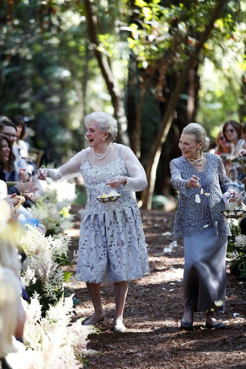 Nancy “Grongong” Rutchik (left) and Flossie “Grammy” Pack, walk down the aisle as flower girls for the wedding of their granddaughter Lucy Schanzer in Carmel, Calif., in 2015. Lucy married Kyle Schanzer.
