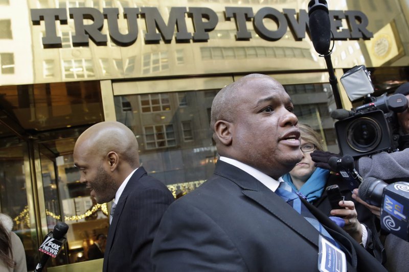 FILE - In this Nov. 30, 2015, file photo, Pastor Mark Burns, co-founder &amp; CEO of Christian Television Network, from Easley, S.C., right, speaks to the members of the media outside Trump Tower in New York. A few of President Donald Trump&#x2019;s leading evangelical supporters defended him after he questioned why the U.S. should accept more immigrants from Haiti and &quot;shithole countries&#x201d; in Africa. However, many other evangelicals condemned his remarks, citing their increasing devotion to fellow Christians overseas, along with the large numbers of immigrants in U.S. churches and their families. (AP Photo/Richard Drew, File)