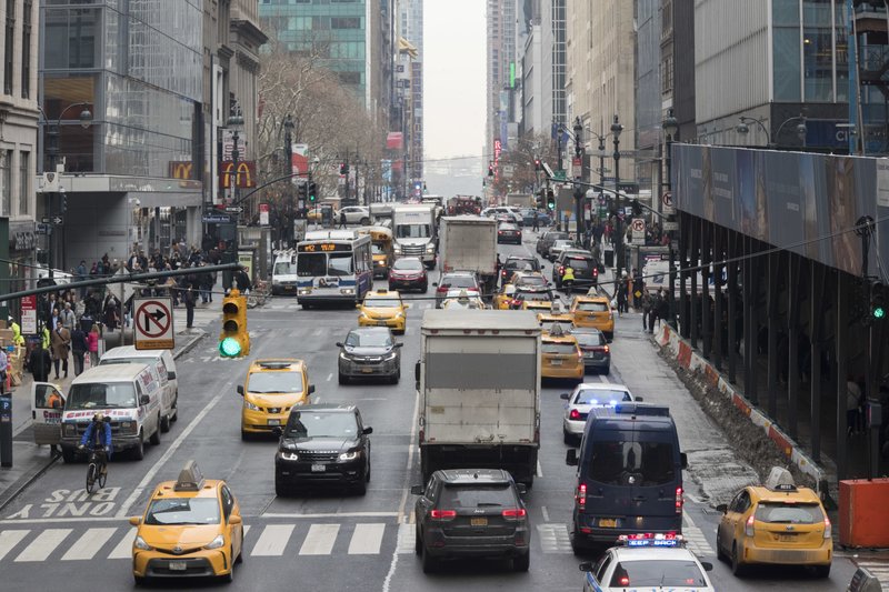 In this Thursday, Jan. 11, 2018 photo, traffic is seen making it's way across 42nd Street in New York. A proposal to make part Manhattan a toll zone, where drivers would be charged to drive into the most congested neighborhoods, is gaining momentum, despite continuing criticism from lawmakers representing car-heavy parts of Brooklyn and Queens. (AP Photo/Mary Altaffer)