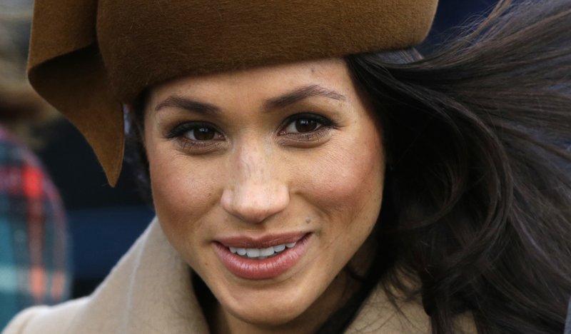 In this file photo dated Monday, Dec. 25, 2017, Meghan Markle fiancee of Prince Harry walks with members of the British Royal family for the traditional Christmas Day church service, at St. Mary Magdalene Church in Sandringham, England. The U.K. Independence Party has suspended the membership of Jo Marney, the girlfriend of the party's leader, Sunday Jan. 14, 2018, after she reportedly made racist remarks about Markle.