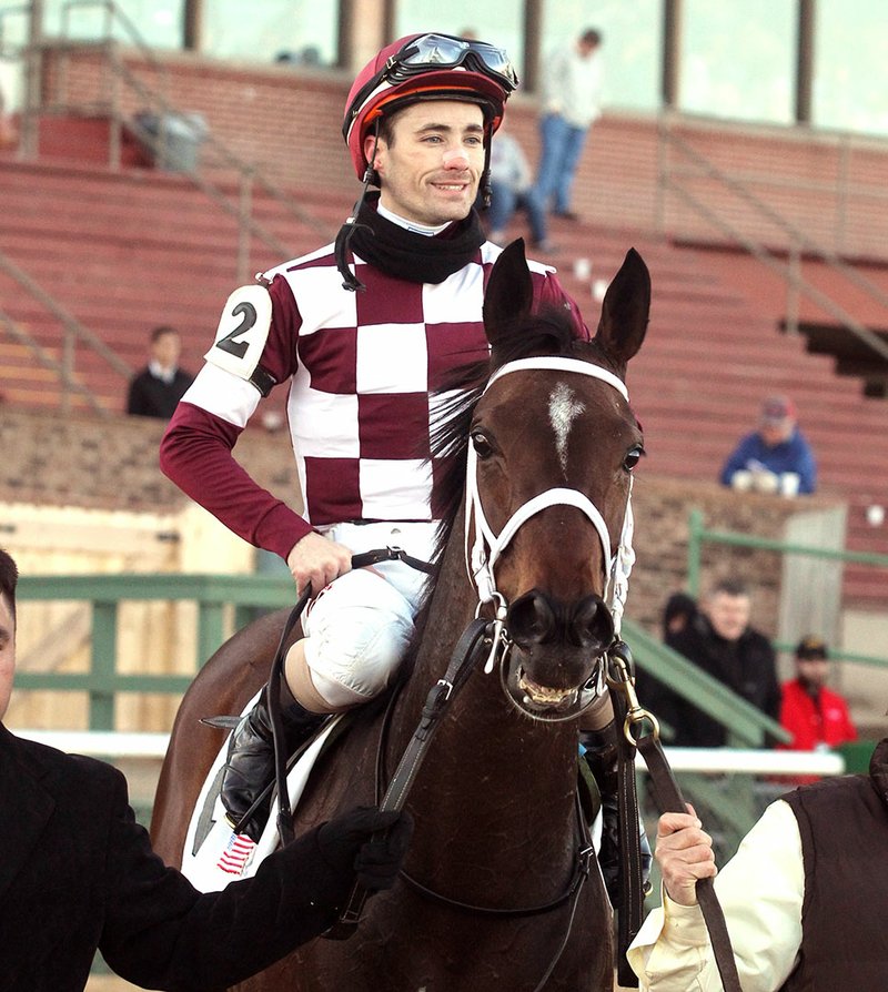 The Sentinel-Record/Richard Rasmussen

PIPPIN WINNER: Jockey Channing Hill celebrates aboard Farrell after winning the Pippin Stakes Saturday at Oaklawn Park.