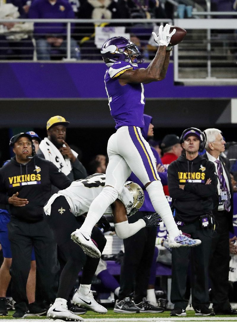 Minnesota Vikings wide receiver Stefon Diggs makes a catch over New Orleans Saints free safety Marcus Williams
on his way to the winning touchdown with no time left Sunday. The Vikings defeated the Saints 29-24 to advance to the NFC Championship Game