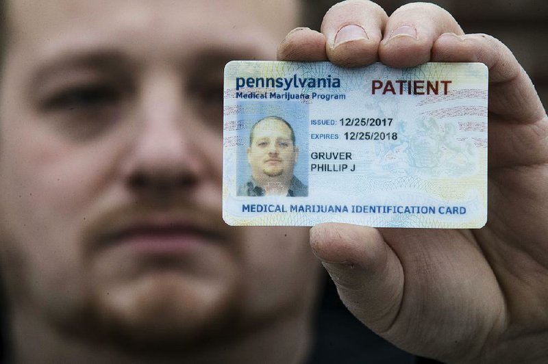 Phil Gruver shows his Pennsylvania medical-marijuana card last week in Emmaus, Pa.
