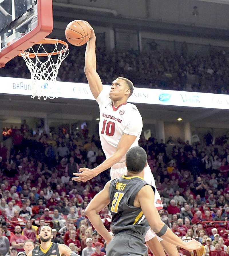 Craven Whitlow/Special to The Sentinel-Record TEAM HIGH: Arkansas freshman Daniel Gafford (10) throws down a dunk for two of his team-leading 15 points Saturday in a 65-63 SEC win over Missouri at Bud Walton Arena in Fayetteville. Gafford scored the go-ahead basket to break a 63-63 tie inside the final minute of the game.