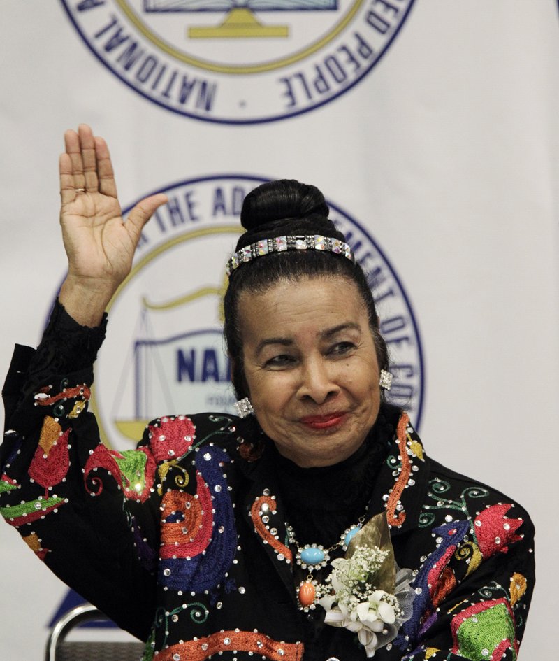 FILE - In this May 2, 2011, file photo, Xernona Clayton waves at the NAACP Freedom Dinner news conference in Detroit. Clayton says Martin Luther King Jr.&#x2019;s message about love and hate &#x201c;is so applicable to today.&#x201d; In this day and age, &#x201c;we have to drive out hate any way we can. We have to strengthen love any way we can,&#x201d; she says. (AP Photo/Carlos Osorio, File)