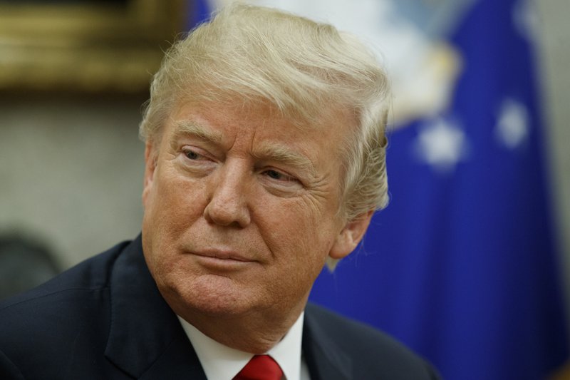 FILE - In this Jan. 10, 2018, file photo, President Donald Trump listens during a meeting in the Oval Office of the White House, in Washington. Casting a cloud over already tenuous negotiations, President Donald Trump said Sunday, Jan. 14, that Deferred Action for Childhood Arrivals program, or DACA, a program that protects immigrants who were brought to the U.S. as children and live here illegally is &#x201c;probably dead&#x201d; and blamed Democrats, days before some government functions would start shutting down unless a deal is reached. (AP Photo/Evan Vucci, File)