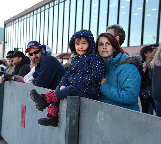 The Sentinel-Record/Grace Brown - Laynnah Sanchez, 3, watches the horses with her mother, Kelsie Sanchez, on opening day of the 2018 racing season at Oaklawn Park on Friday, January 12, 2018. 