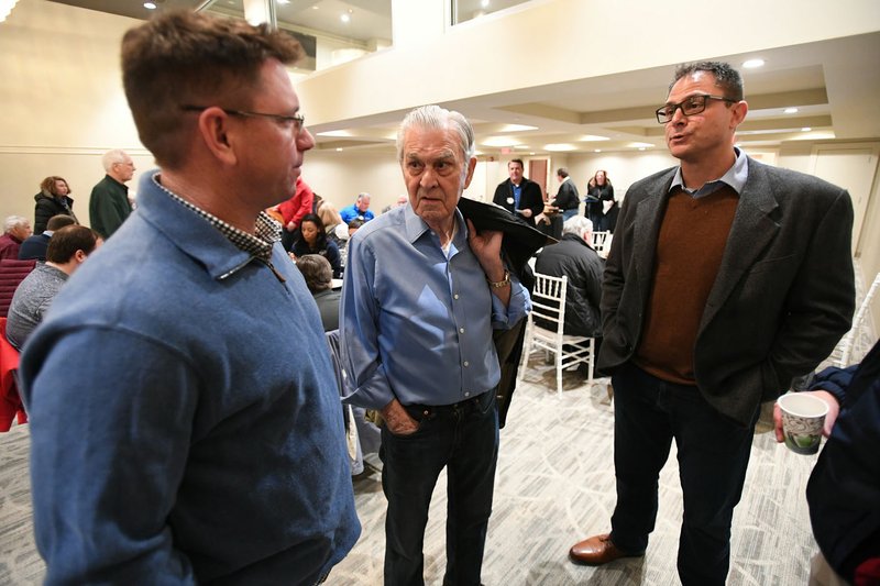J.J. Picollo (right), Kansas City Royals vice president and assistant general manager for player personnel, and Royals Bullpen Coach Vance Wilson (left) visit with Royals owner David Glass on Monday before the Hot Stove Luncheon at The Apollo in Springdale.