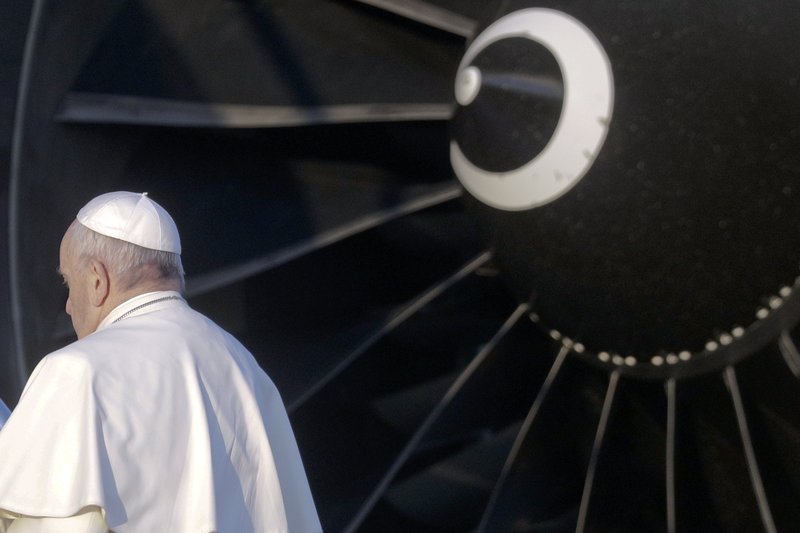 Pope Francis boards the plane on the occasion of his trip to Chile and Peru, at Rome's Leonardo da Vinci international airport in Fiumicino, Monday, Jan. 15, 2018. The pontiff is visiting Chile from January 15-18, then will head to Peru, where he'll stay until January 21. (AP Photo/Gregorio Borgia)