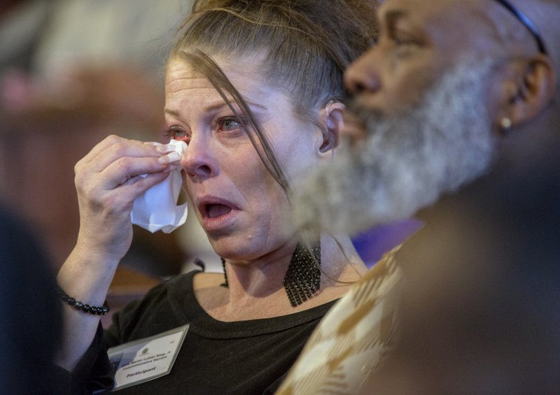 Debra Harris listens as the Rev. Martin Luther King Jr.'s daughter, the Rev. Bernice King speaks during the Martin Luther King Jr. annual commemorative service at Ebenezer Baptist Church in Atlanta on Monday, Jan. 15, 2018. (Phil Skinner/Atlanta Journal-Constitution via AP)