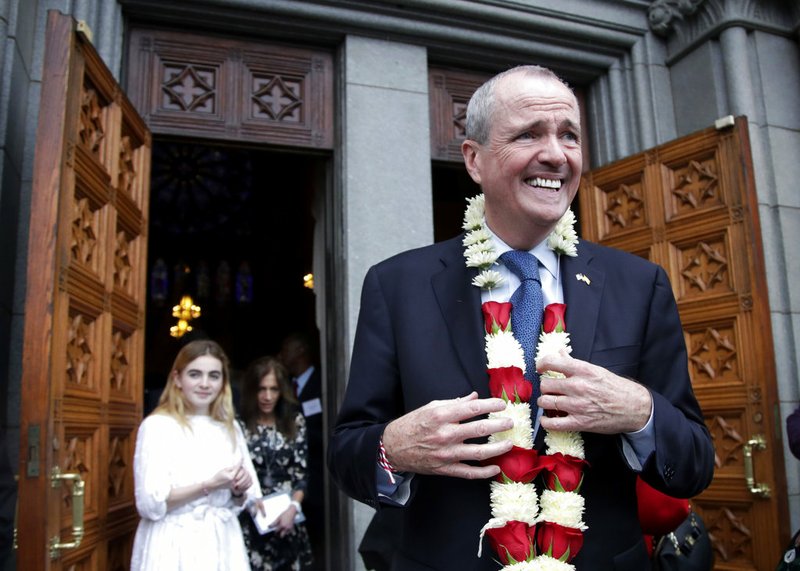 AP Photo/Julio Cortez New Jersey Gov.-elect Phil Murphy walks out of the Cathedral Basilica of the Sacred Heart following a prayer service for him, Friday, Jan. 12, 2018, in Newark, N.J. New Jersey's next governor is kicking off a series of events leading to his inauguration. Murphy and Lt. Gov.-elect Sheila Oliver plan to visit various towns on Saturday to promote opportunities for transit. Events are planned on Sunday and Monday before they are sworn into office at the War Memorial in Trenton on Tuesday.