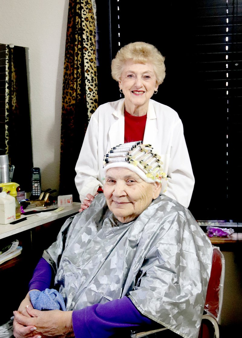 LYNN KUTTER ENTERPRISE-LEADER Ruth Dial of Prairie Grove gives a permanent to Louella Yates. Dial, 90, has been a hair stylist for about 60 years. She's at Touch of Color now and has been working in Prairie Grove since 1974. Yates of Fayetteville has come to Dial for 40 years.