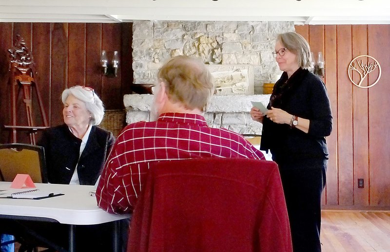 Lynn Atkins/The Weekly Vista Linda Hughes (standing) presents a few tips to the members of the Village Lake Writers and Poets about writing memoirs.