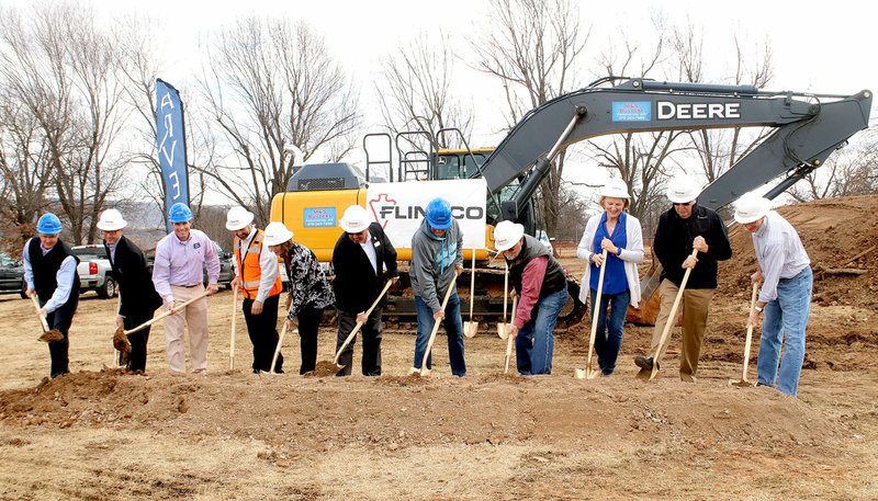 LYNN KUTTER ENTERPRISE-LEADER Arvest Bank held a groundbreaking ceremony Thursday for its new branch in Prairie Grove on Heritage Parkway. Those with shovels include bank officials, Arvest Bank Board members for the Prairie Grove region, city officials and representatives of the contractor and engineering firms involved in the project. The new bank is scheduled to be finished in mid-2018.