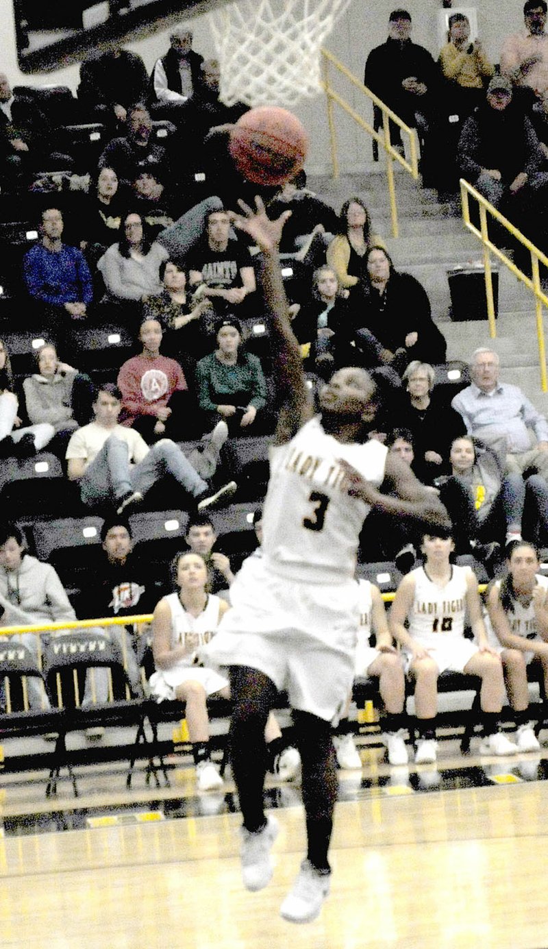 MARK HUMPHREY ENTERPRISE-LEADER/Prairie Grove sophomore Aniyah Gibbs scored six straight points, including this layup, during a crucial fourth quarter stretch as Prairie Grove held off Elkins, 42-37, Friday.