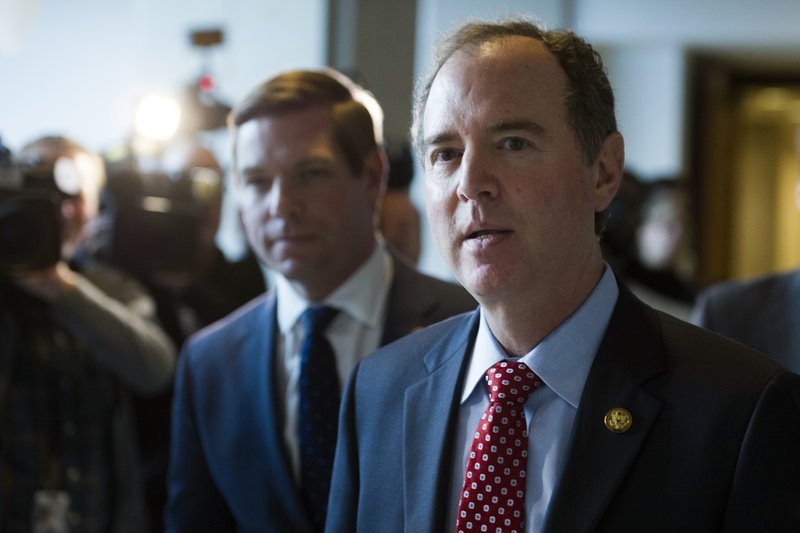 House Intelligence Committee Ranking Member Adam Schiff, D-Calif., walks from a committee meeting where former White House strategist Steve Bannon is testifying, on Capitol Hill in Washington, Tuesday, Jan. 16, 2018. (AP Photo/Cliff Owen)