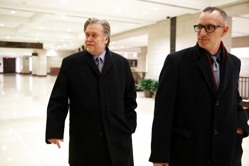 AP Photo/Jacquelyn Martin Former White House strategist Steve Bannon, left, leaves a House Intelligence Committee meeting where he was interviewed behind closed doors on Capitol Hill, Tuesday, Jan. 16, 2018, in Washington.