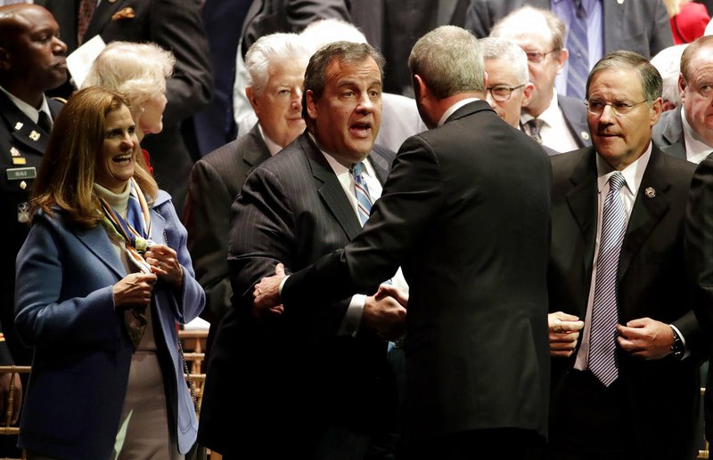 AP Photo/Julio Cortez Former New Jersey Gov. Chris Christie, center left, shakes hands with Gov. Phil Murphy, center right, after Murphy gave his address after being sworn in as governor during his inauguration, Tuesday, Jan. 16, 2018, in Trenton, N.J.