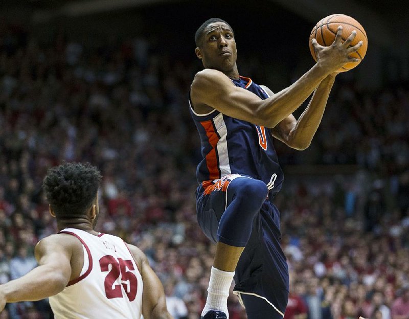 Auburn’s Horace Spencer shoots over Alabama’s Braxton Key in the Tigers’ 76-71 loss Wednesday night in Coleman Coliseum in Tuscaloosa, Ala.  
