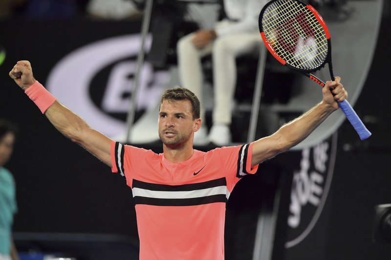 Bulgaria's Grigor Dimitrov celebrates after defeating United States' Mackenzie McDonald in their second round match at the Australian Open tennis championships in Melbourne, Australia, Wednesday, Jan. 17, 2018. (AP Photo/Andy Brownbill)