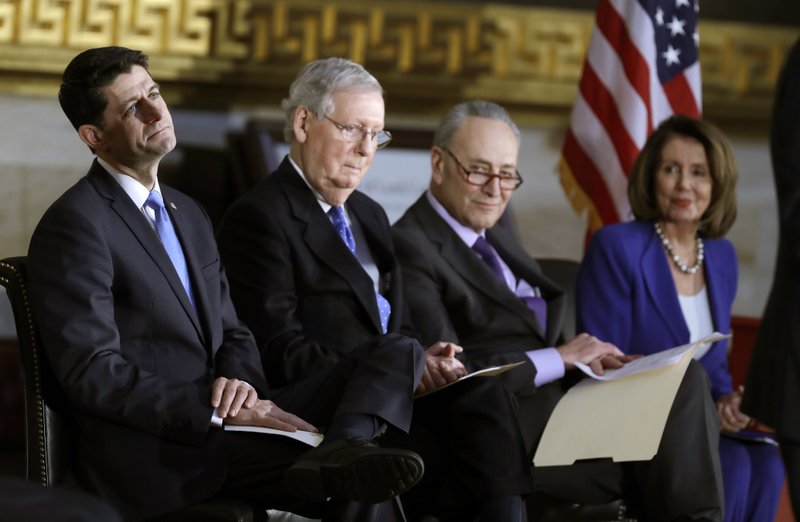 House Speaker Paul Ryan of Wis., Senate Majority Leader Mitch McConnell of Ky., Senate Minority Leader Chuck Schumer of N.Y., and House Minority Leader Nancy Pelosi of Calif., attend a Congressional Gold Medal ceremony honoring former Senator Bob Dole on Capitol Hill, Wednesday, Jan. 17, 2018, in Washington. (AP Photo/Evan Vucci)