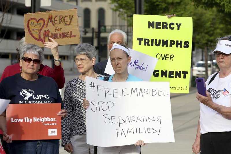 FILE - In this April 10, 2017, file photo, Nuns on the Bus, The Intercommunity Justice and Peace Center (IJPC) and other community members protest in Cincinnati against the deportation of Maribel Trujillo Diaz in Cincinnati. A federal appeals court is ordering U.S. immigration authorities to reconsider the case of Diaz, a Mexican mother of four U.S.-born children, who was deported last year while claiming she faced targeting by a Mexican drug cartel. A three-judge panel of the Cincinnati-based 6th U.S. Circuit Court of Appeals ruled Wednesday, Jan. 17, 2018, in favor of Diaz. (Cara Owsley/The Cincinnati Enquirer via AP, File)