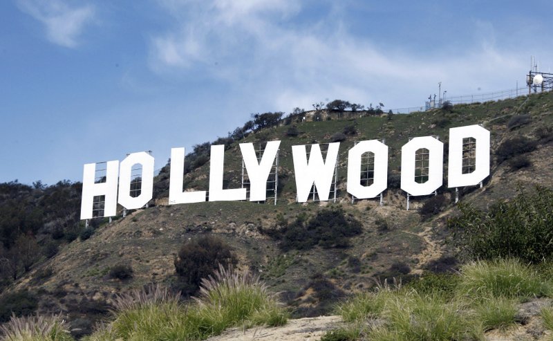 FILE - This Jan. 29, 2010 file photo, the Hollywood sign sits near the top of Beachwood Canyon adjacent to Griffith Park in the Hollywood Hills of Los Angeles. Locals and tourists alike appreciate the Hollywood sign, so why not build another? That's one of the suggestions from a study seeking ways to ease frustration about traffic near the world famous sign in Los Angeles. (AP Photo/Reed Saxon, File)