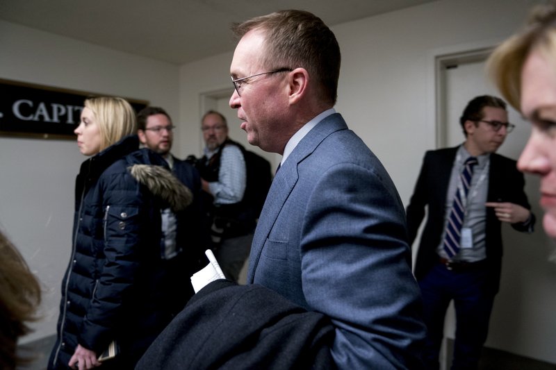 Budget Director Mick Mulvaney arrives on Capitol Hill in Washington, Thursday, Jan. 18, 2018. (AP Photo/Andrew Harnik)