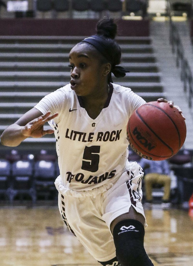 Freshman guard Tori Lasker was recruited by UALR and Arkansas State before choosing the Trojans. “I wanted to play for a winning team,” she said. “So, I chose [UALR Coach] Joe Foley.”