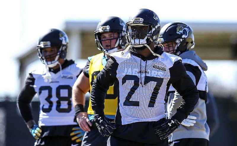 Jacksonville Jaguars running back Leonard Fournette (27) takes part in a drill during Thursday’s practice in Jacksonville. Fournette said he is ready to go for Sunday’s game against the New England Patriots despite re-injuring his ankle and being in a fender-bender earlier this week. 

