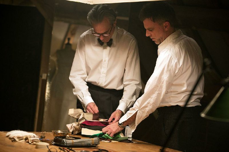 Actor Daniel Day-Lewis (left) discusses a scene with writer/director Paul Thomas Anderson on the set of their latest collaboration, Phantom Thread.
