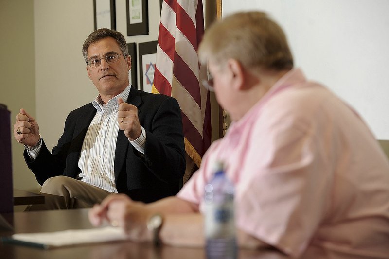 State Rep. Charlie Collins (left), R-Fayetteville, is shown in this 2014 file photo.