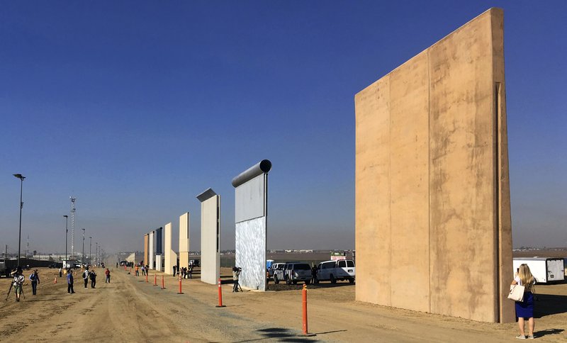 This Oct. 26, 2017 file photo shows prototypes of border walls in San Diego. Rigorous testing of prototypes of President Donald.